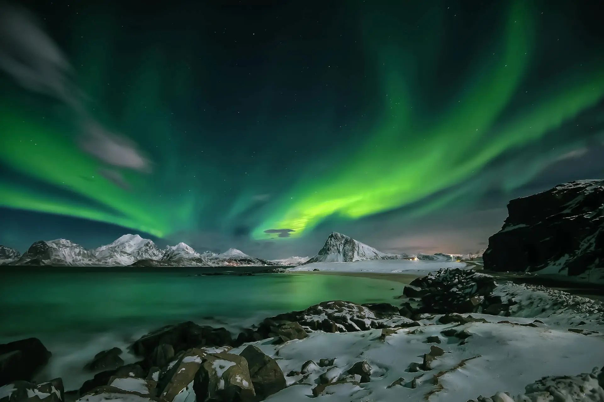 Northern lights reflected on a lake in Canada's north